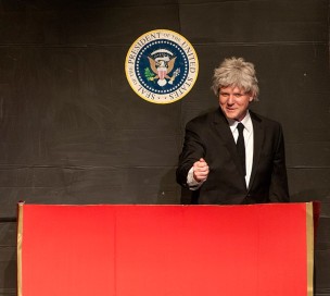 Zeek Martin plays former President Bill Clinton in a whack-a-mole sketch.