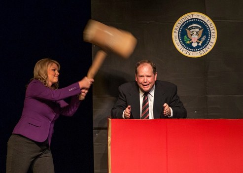 Channing Barker whacks a mole, in this case former president George W. Bush, played by Charlie Alison