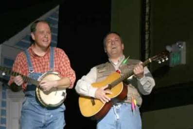 Charlie Alison as Buck Owens and Greg Harton as Roy Clark, hosts of Hee Haw.